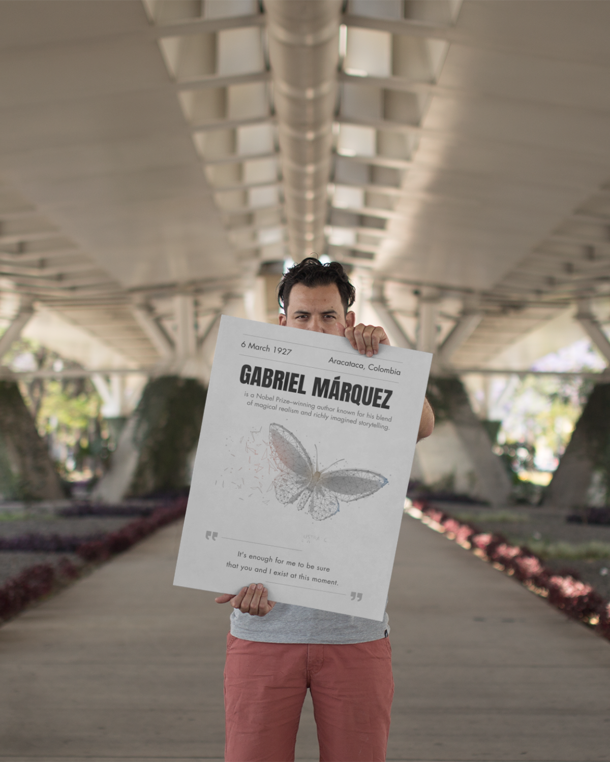 Gabriel-garcia-marquez-person-holding-poster-outside-musings-of-a-reader