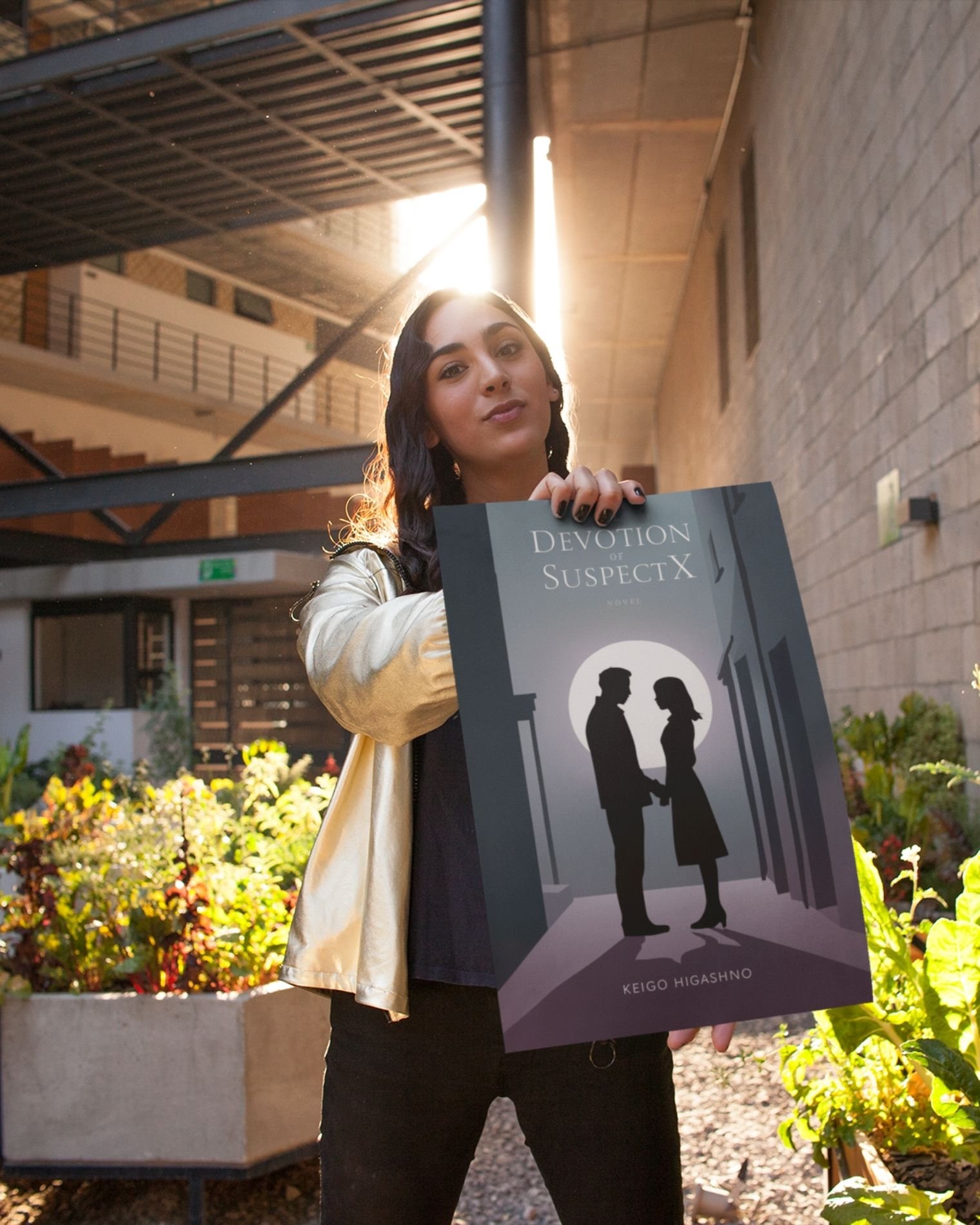 The-devotion-of-suspect-x-keigo-higashino-person-holding-poster-courtyard-musings-of-a-reader